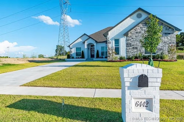 6442 E 148th St S, Bixby, OK 74008 - french provincial home with a front lawn, stone siding, and driveway