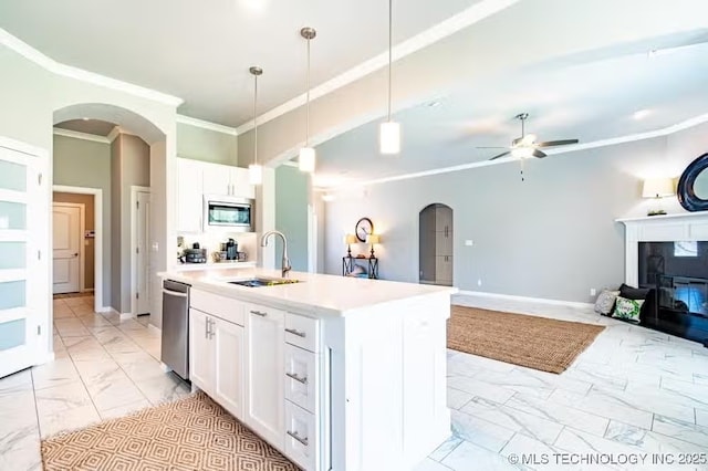 6442 E 148th St S, Bixby, OK 74008 - kitchen with marble finish floor, ornamental molding, a sink, arched walkways, and stainless steel appliances