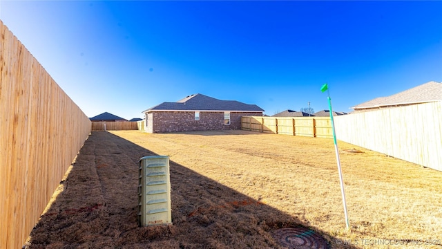 view of yard featuring a fenced backyard