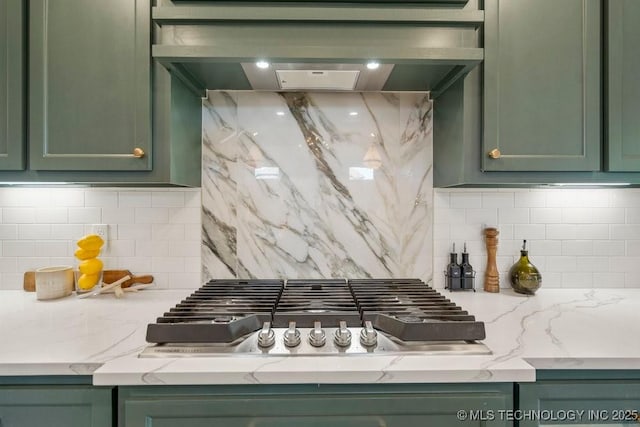 16804 E 43rd St S, Tulsa, OK 74134 - kitchen featuring custom range hood, backsplash, stainless steel gas cooktop, and green cabinetry