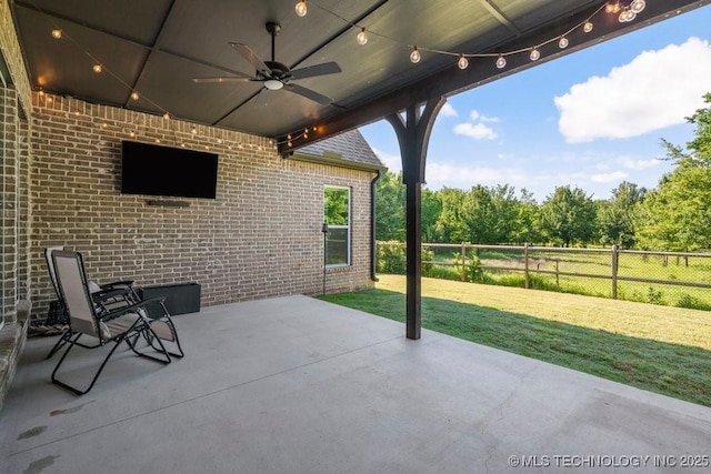 16804 E 43rd St S, Tulsa, OK 74134 - view of patio / terrace with a ceiling fan and fence