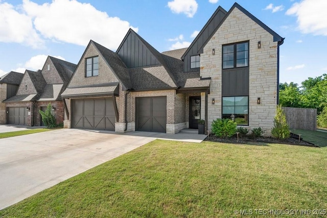 16804 E 43rd St S, Tulsa, OK 74134 - view of front of home with stone siding, board and batten siding, a front yard, brick siding, and driveway