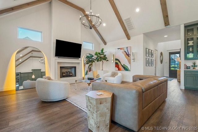 16804 E 43rd St S, Tulsa, OK 74134 - living area with visible vents, high vaulted ceiling, dark wood-type flooring, a fireplace, and beam ceiling