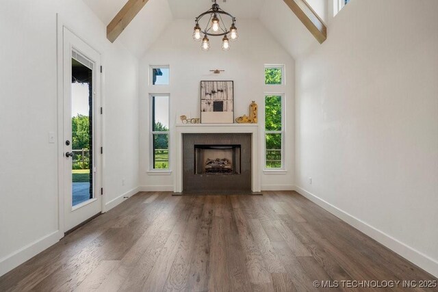 16804 E 43rd St S, Tulsa, OK 74134 - unfurnished living room featuring wood finished floors, high vaulted ceiling, a chandelier, baseboards, and a fireplace with flush hearth