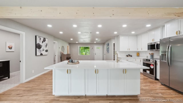 4010 E Harris, Muskogee, OK 74403 - kitchen with recessed lighting, a sink, light countertops, white cabinets, and appliances with stainless steel finishes