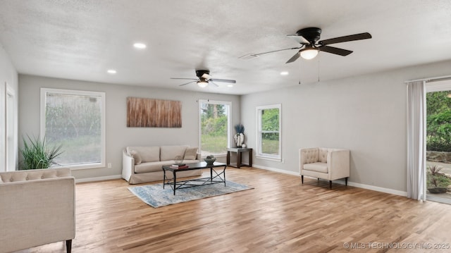 4010 E Harris, Muskogee, OK 74403 - living area with baseboards, recessed lighting, light wood finished floors, and ceiling fan