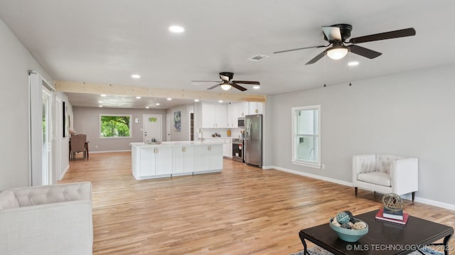 4010 E Harris, Muskogee, OK 74403 - living room featuring light wood-type flooring, visible vents, recessed lighting, ceiling fan, and baseboards