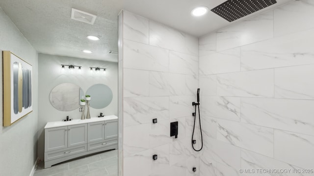 4010 E Harris, Muskogee, OK 74403 - full bath with a tile shower, recessed lighting, visible vents, and double vanity