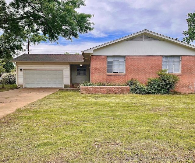 ranch-style house with a garage, a front lawn, brick siding, and driveway