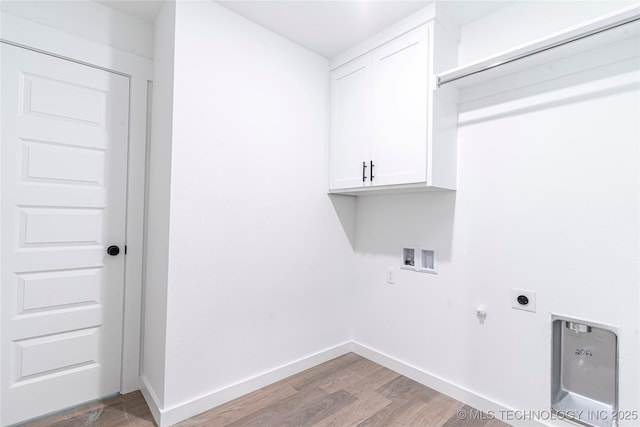 laundry area featuring light wood-style flooring, baseboards, hookup for a washing machine, hookup for an electric dryer, and cabinet space