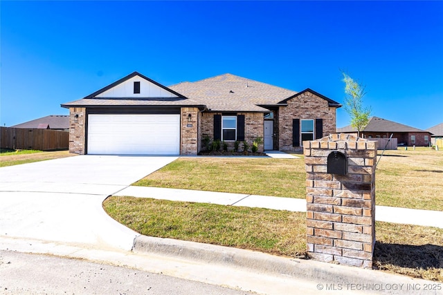 single story home featuring concrete driveway, an attached garage, a front lawn, and brick siding