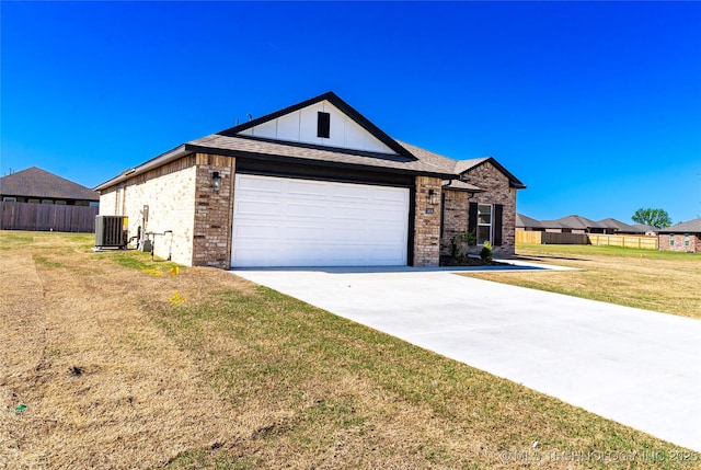 ranch-style house featuring fence, central air condition unit, concrete driveway, a front yard, and brick siding