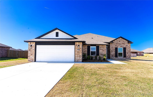 single story home featuring driveway, brick siding, and a front yard