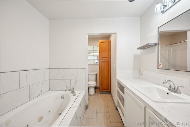 1109 S Division St, Sapulpa, OK 74066 - full bath with a tub with jets, vanity, and toilet