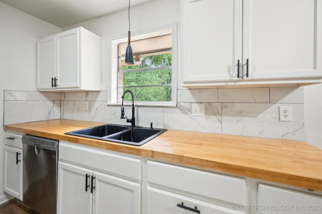 1109 S Division St, Sapulpa, OK 74066 - kitchen with a sink, stainless steel dishwasher, butcher block counters, and white cabinetry