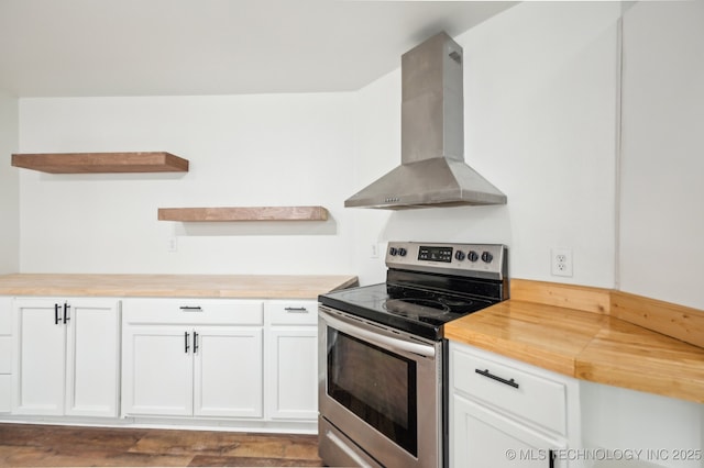 1109 S Division St, Sapulpa, OK 74066 - kitchen with wood counters, white cabinetry, open shelves, stainless steel range with electric cooktop, and wall chimney range hood