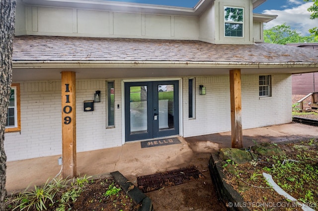 1109 S Division St, Sapulpa, OK 74066 - entrance to property featuring brick siding, french doors, and a porch
