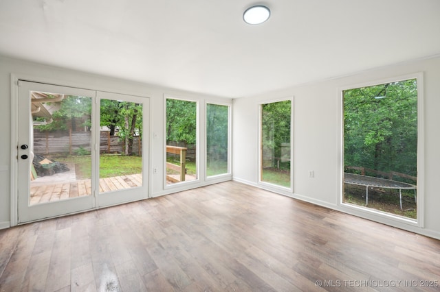 1109 S Division St, Sapulpa, OK 74066 - unfurnished sunroom featuring baseboards and wood finished floors
