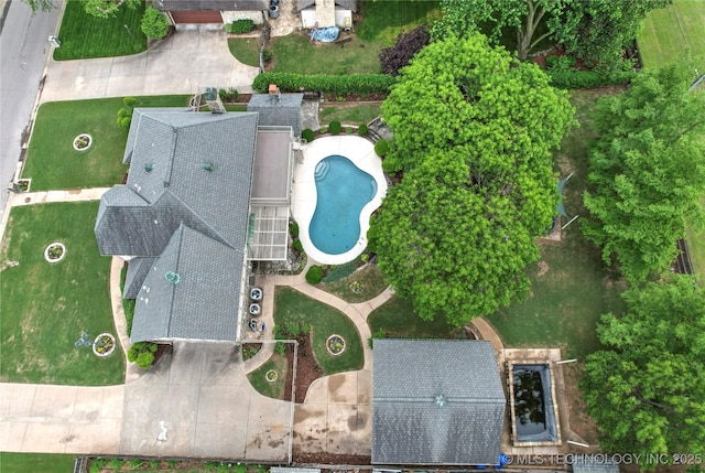 drone / aerial view of a pool