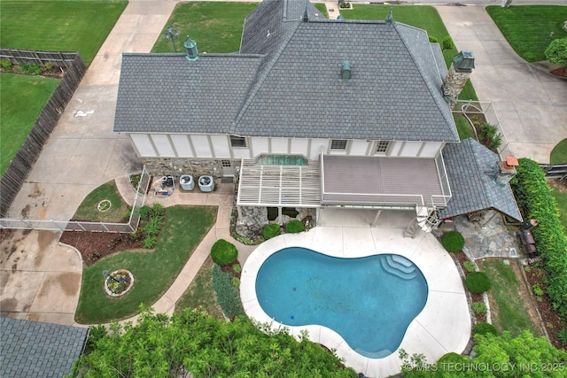 view from above of property featuring a pool area