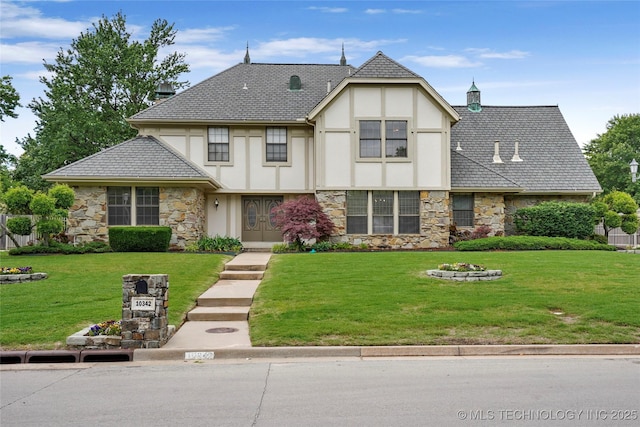 view of front of home with stone siding, stucco siding, and a front yard