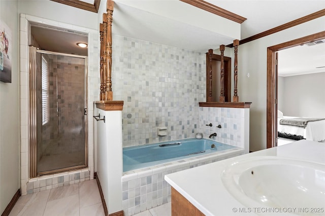 full bathroom featuring crown molding, tile patterned flooring, a shower stall, a garden tub, and baseboards