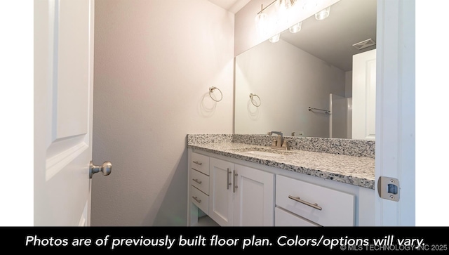 bathroom with vanity and visible vents