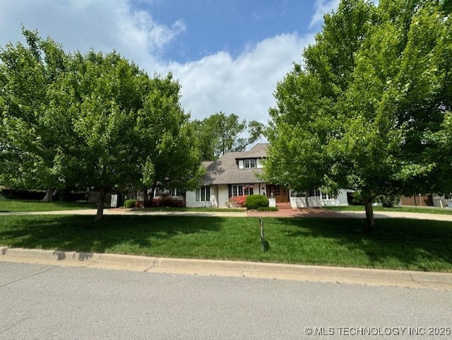 3421 E 62nd St, Tulsa, OK 74136 - view of property hidden behind natural elements featuring a front lawn