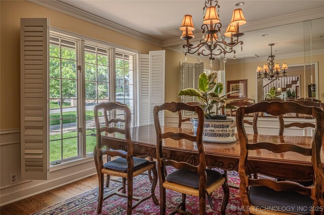 3421 E 62nd St, Tulsa, OK 74136 - dining area with a chandelier, wood finished floors, and crown molding