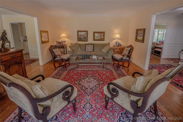 3421 E 62nd St, Tulsa, OK 74136 - living room featuring wood finished floors and crown molding