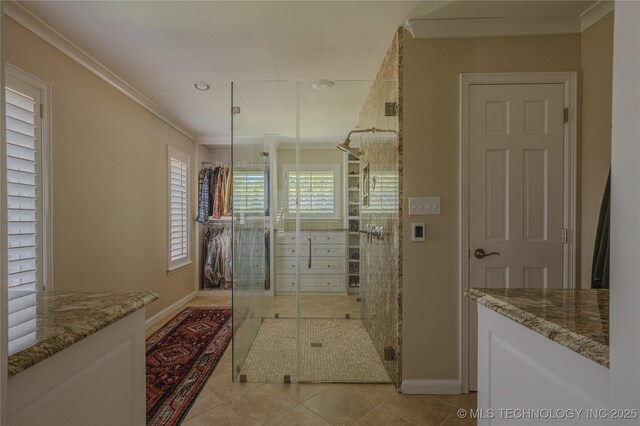 3421 E 62nd St, Tulsa, OK 74136 - bathroom featuring tile patterned floors, baseboards, crown molding, recessed lighting, and a shower stall