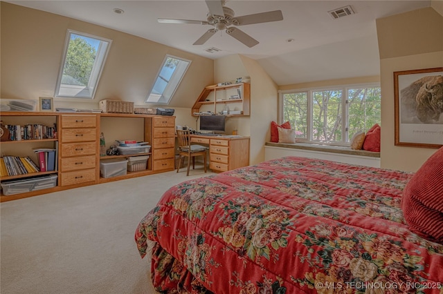 3421 E 62nd St, Tulsa, OK 74136 - bedroom with a skylight, carpet floors, vaulted ceiling, a ceiling fan, and a desk