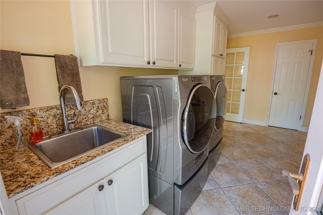 3421 E 62nd St, Tulsa, OK 74136 - washroom with washing machine and clothes dryer, cabinet space, crown molding, and baseboards