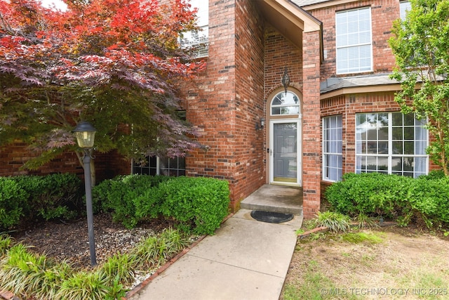 entrance to property with brick siding