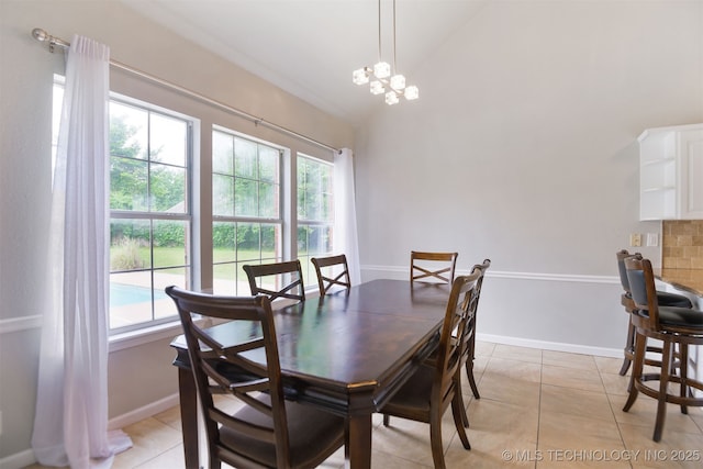 dining room with light tile patterned flooring, baseboards, and high vaulted ceiling