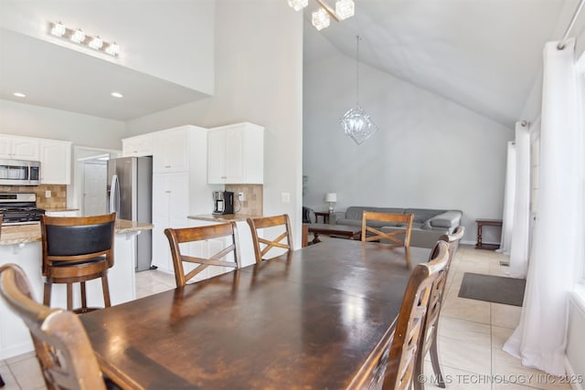 dining room featuring light tile patterned floors, recessed lighting, and high vaulted ceiling