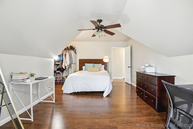 bedroom with vaulted ceiling, wood finished floors, baseboards, and ceiling fan