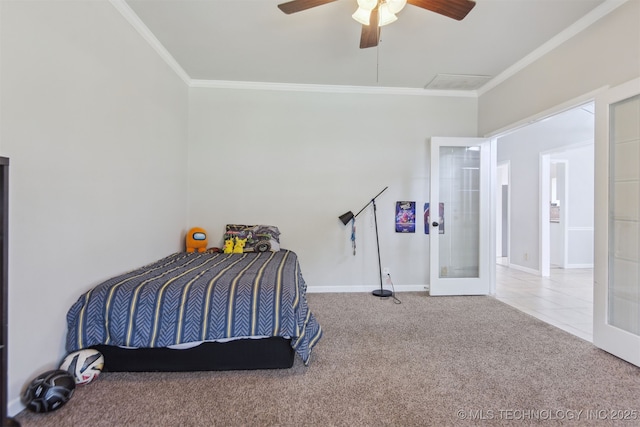 bedroom featuring ornamental molding, french doors, ceiling fan, and carpet