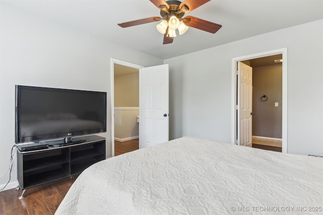 bedroom with dark wood-style flooring, baseboards, and ceiling fan