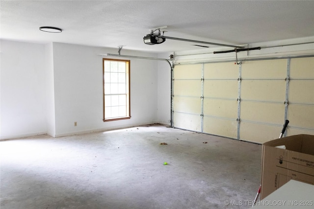 garage featuring baseboards and a garage door opener
