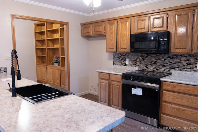 kitchen featuring crown molding, dark wood finished floors, black appliances, backsplash, and light countertops