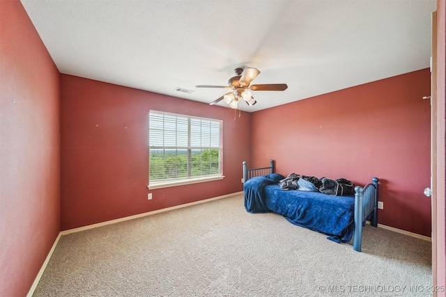 bedroom featuring ceiling fan, carpet, baseboards, and visible vents
