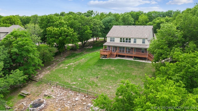 aerial view featuring a wooded view