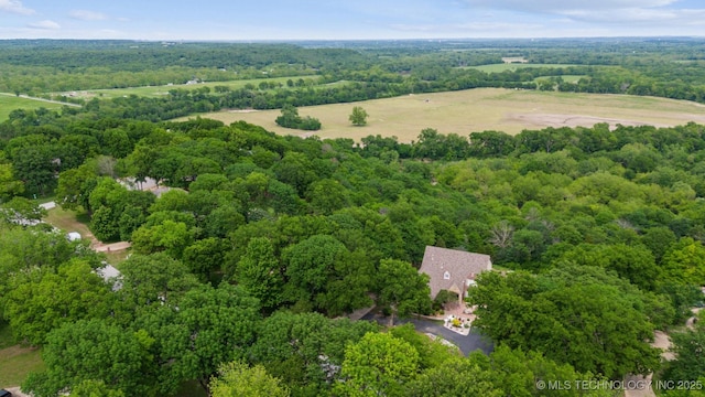 bird's eye view featuring a wooded view