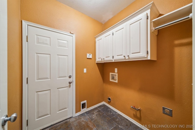 washroom featuring cabinet space, hookup for an electric dryer, hookup for a gas dryer, baseboards, and hookup for a washing machine