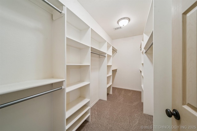 walk in closet with carpet flooring and visible vents