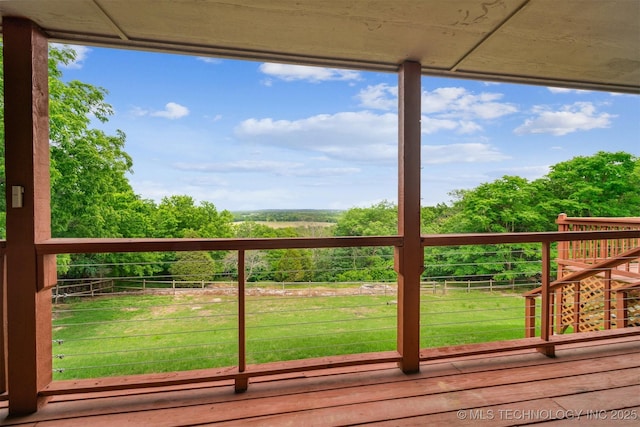 wooden terrace featuring a yard