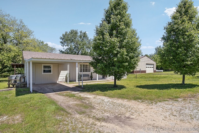 9553 W 71st St S, Tulsa, OK 74131 - view of front of house with a front lawn, dirt driveway, a garage, and a carport