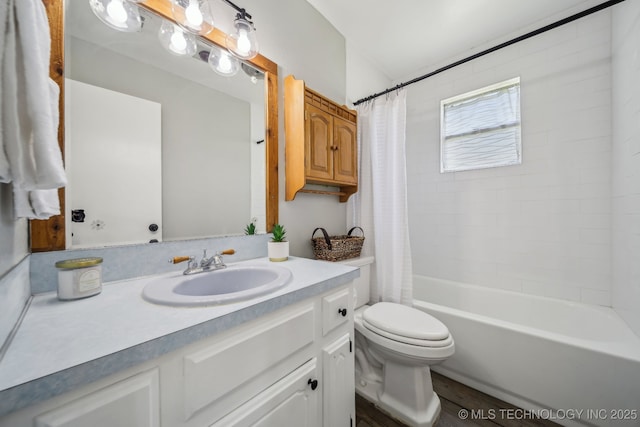 9553 W 71st St S, Tulsa, OK 74131 - bathroom featuring vanity, toilet, shower / tub combo, and wood finished floors