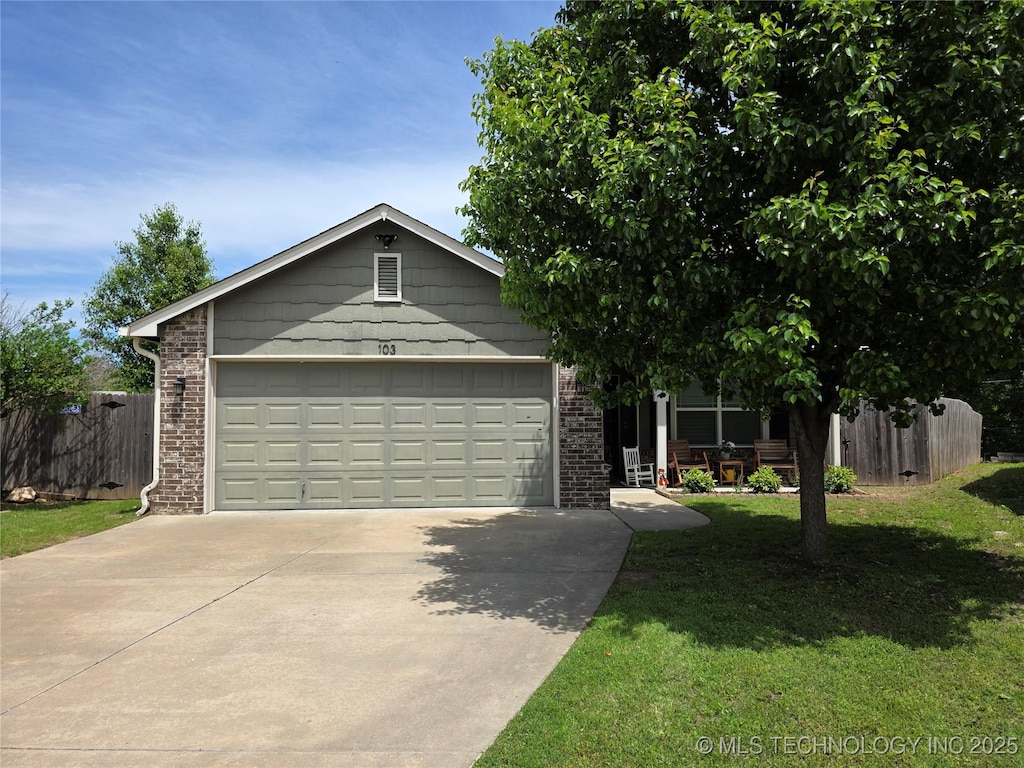 103 W 45th Pl, Sand Springs, OK 74063 - view of front of property with concrete driveway, brick siding, an attached garage, and a porch
